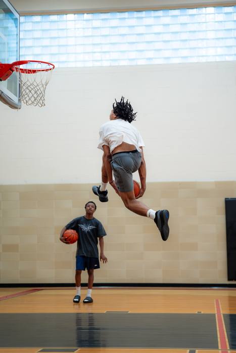 Player soaring toward the rim for a dunk