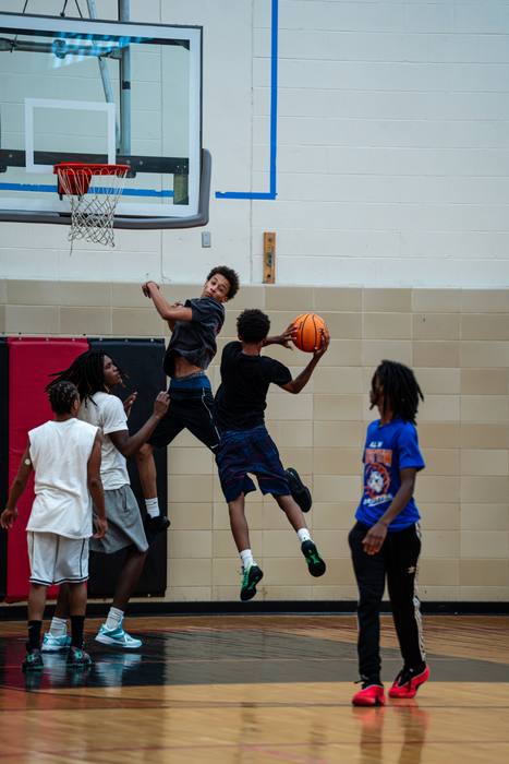 Players battling for a rebound under the basket